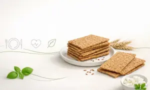 Stos chrupkiego pieczywa, ser biały, bazylia i kłosy zbóż. Czy pieczywo chrupkie jest zdrowe? Tak, to zdrowa przekąska.